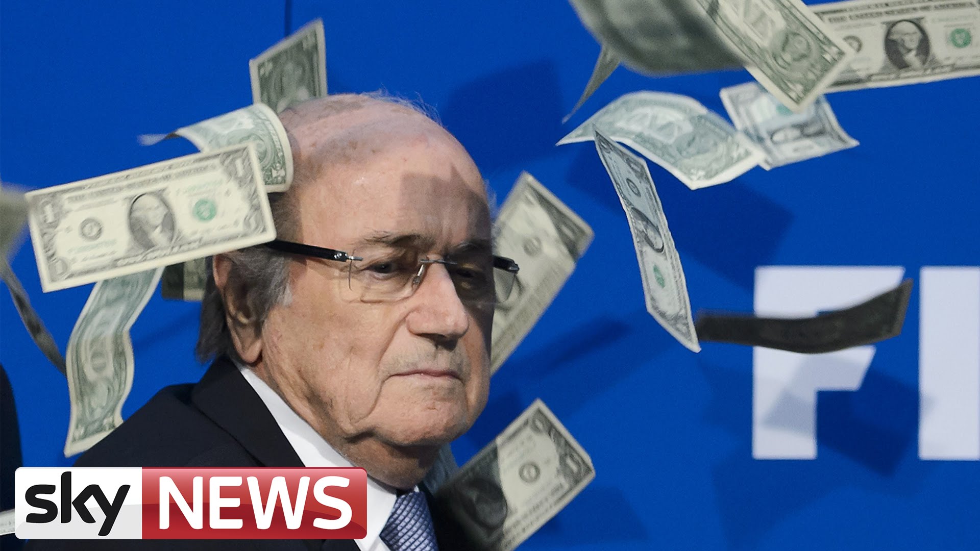 Comedian Simon Brodkin showers FIFA President Sepp Blatter with cash