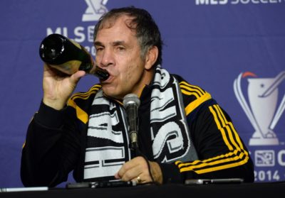 Dec 7, 2014; Los Angeles, CA, USA; Los Angeles Galaxy head coach Bruce Arena drinks from a bottle of champagne at a press conference after the 2014 MLS Cup final against the New England Revolution at Stubhub Center. Mandatory Credit: Jayne Kamin-Oncea-USA TODAY Sports ORG XMIT: USATSI-189486 ORIG FILE ID: 20141207_jla_aj4_301.jpg